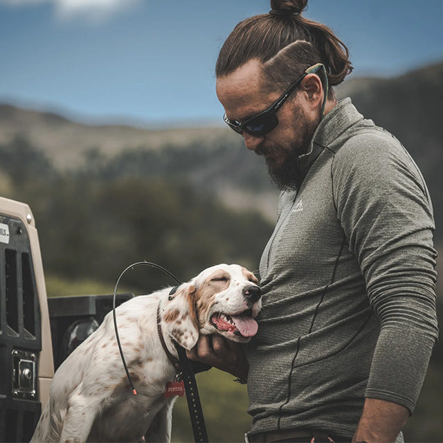 Man wearing a Pnuma outdoors merino wool base layer shirt