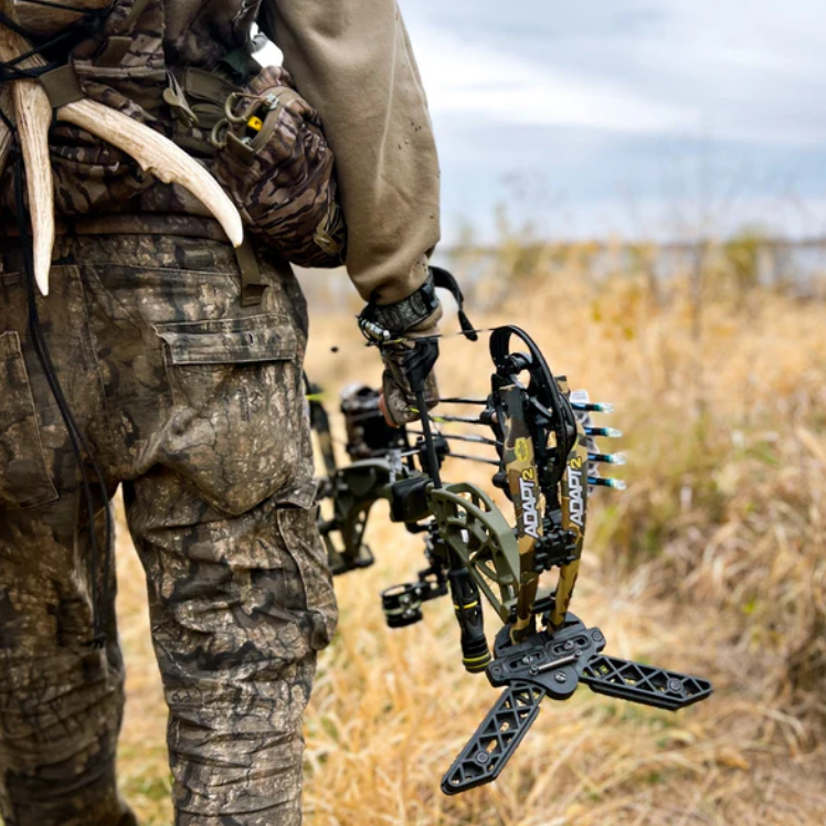Hunter with a compound bow in hand